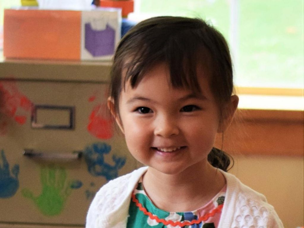 Smiling girl with black hair